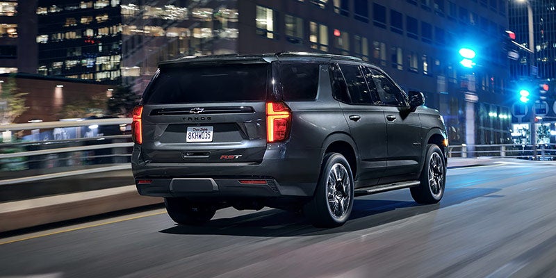 2021 Chevrolet Tahoe driving downtown at night