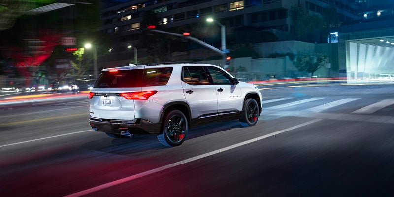 2023 Chevrolet Traverse driving downtown at night