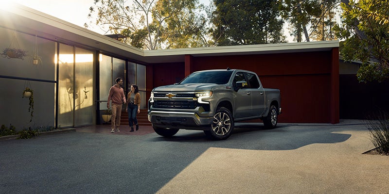 2025 Chevrolet Silverado 1500 couple walking to vehicle